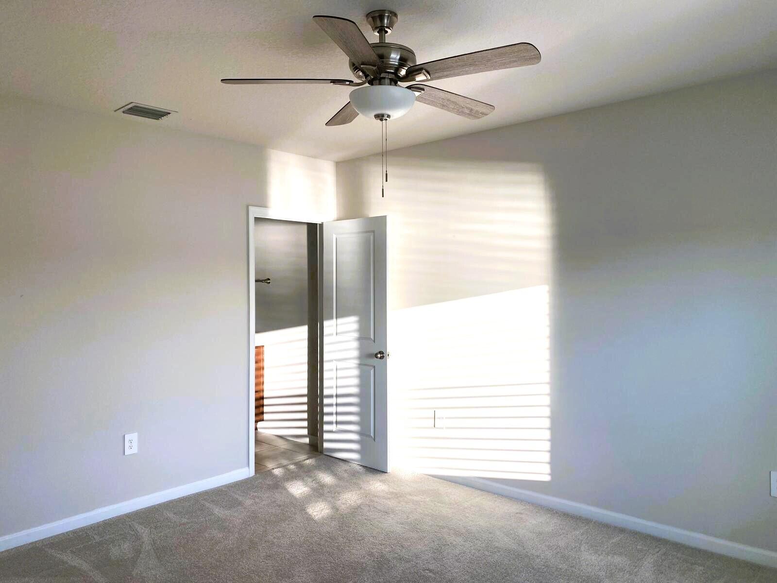 106 Pummelo Place Fort Pierce, FL 34981 - Photo 12 of 27 a view of an empty room with a window