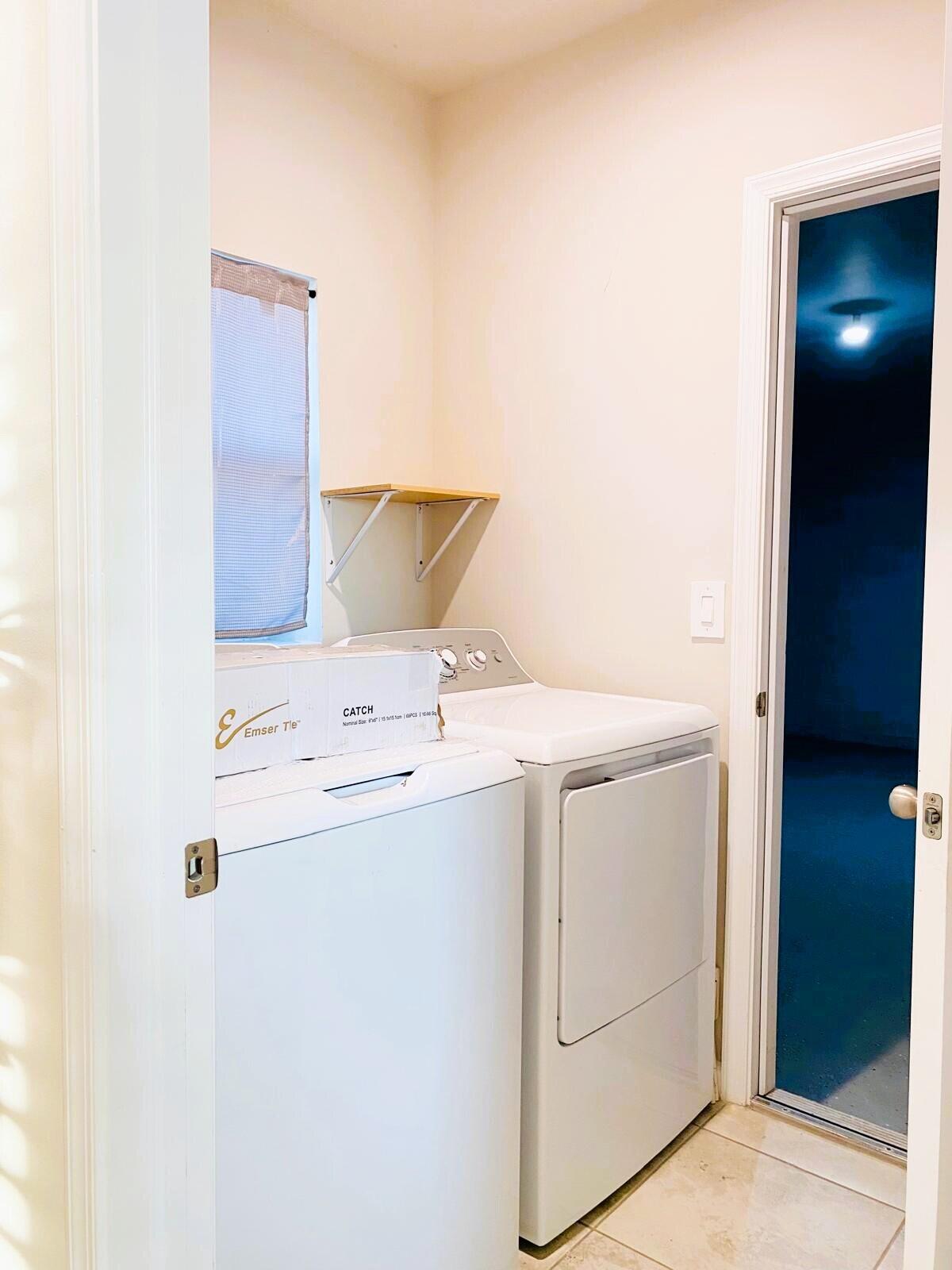106 Pummelo Place Fort Pierce, FL 34981 - Photo 14 of 27 a utility room with dryer and washer