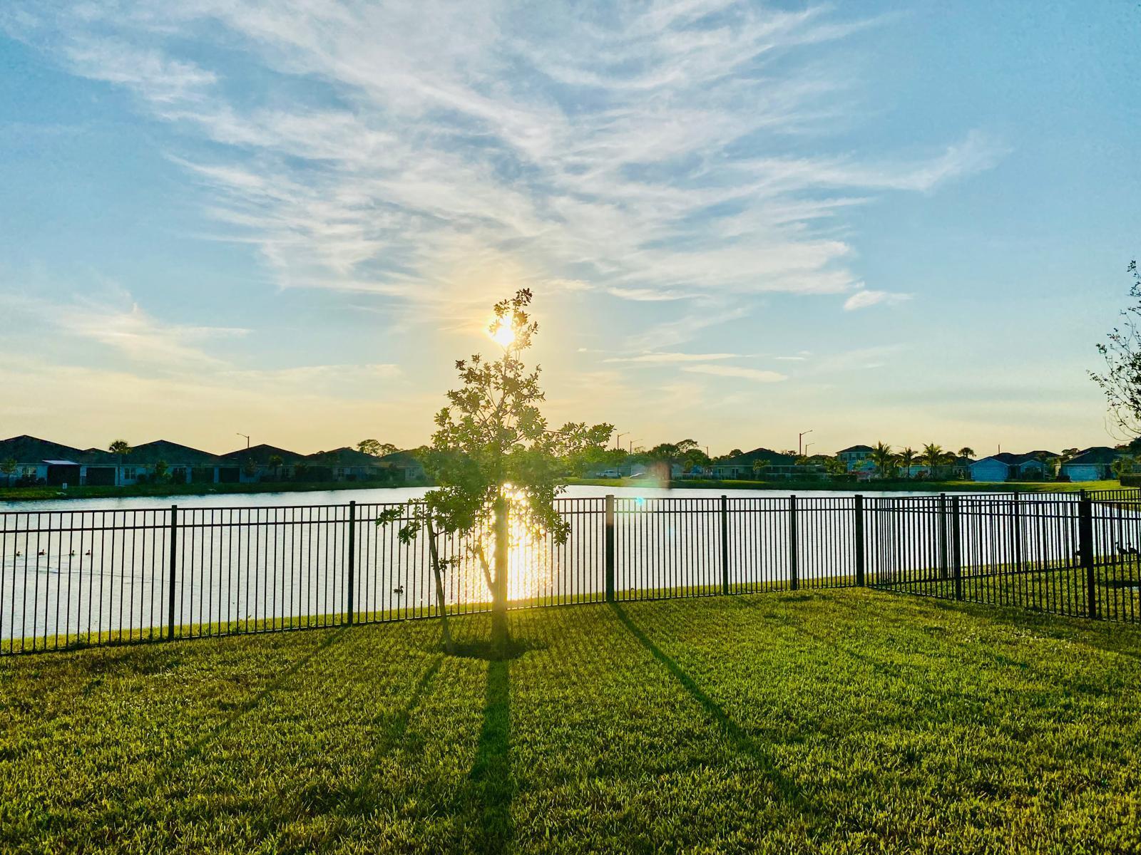 106 Pummelo Place Fort Pierce, FL 34981 - Photo 25 of 27 a view of a garden with a large tree