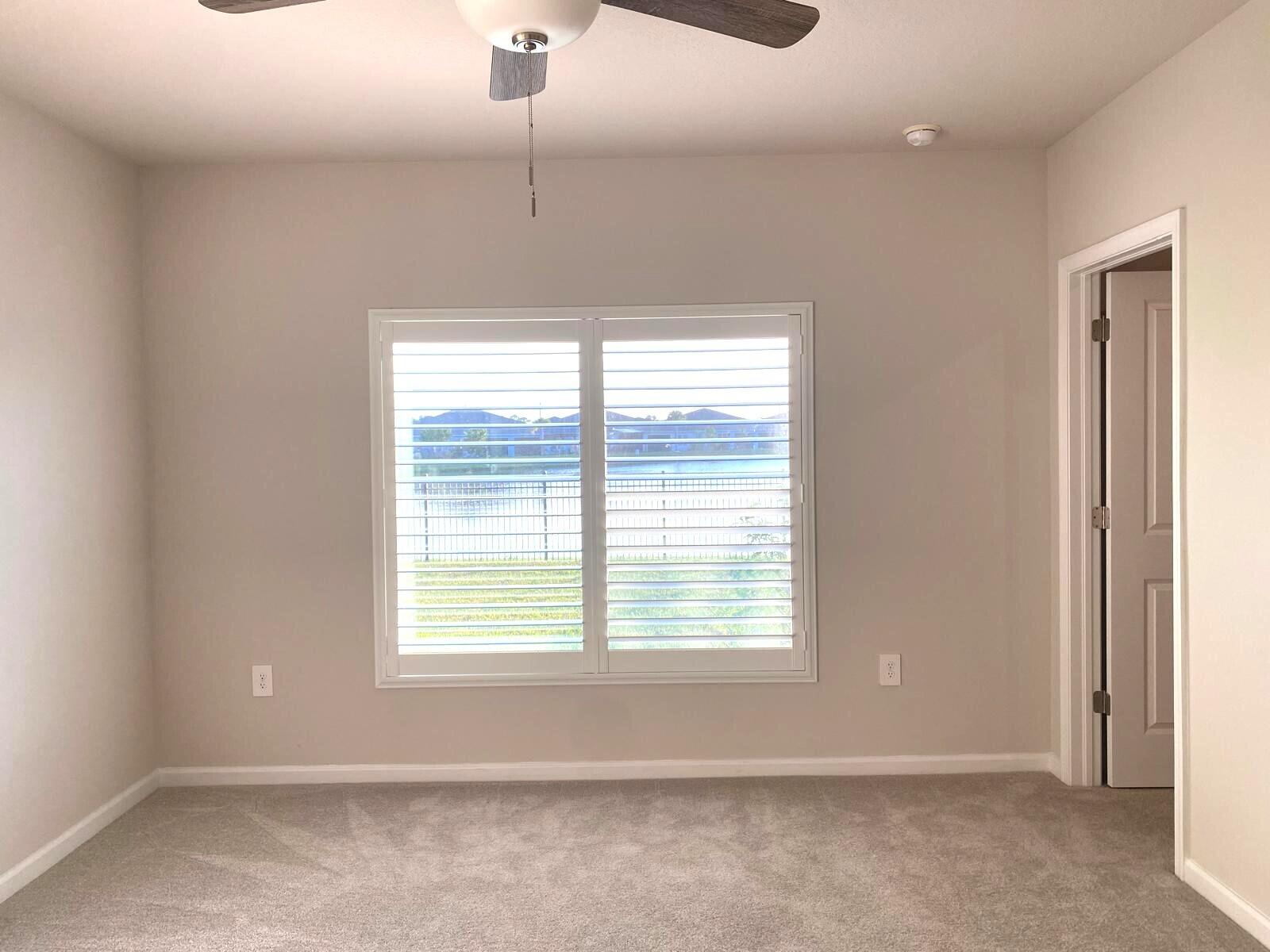 106 Pummelo Place Fort Pierce, FL 34981 - Photo 7 of 27 a view of an empty room with a window