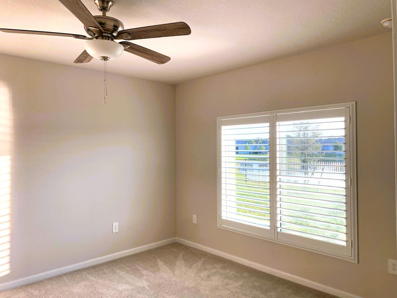 106 Pummelo Place Fort Pierce, FL 34981 - Photo 9 of 27 a view of a room with a window and a fan