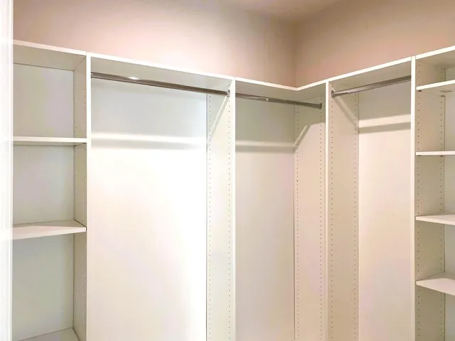 a bathroom with a shower and a glass door