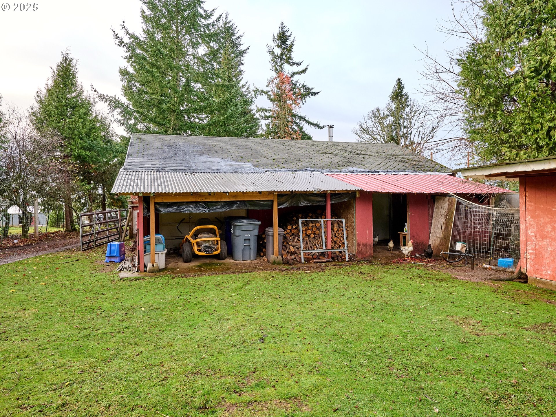 20788 Hazelnut Ridge Road Scotts Mills, OR 97375 - Photo 30 of 46 a view of a house with a yard and sitting area