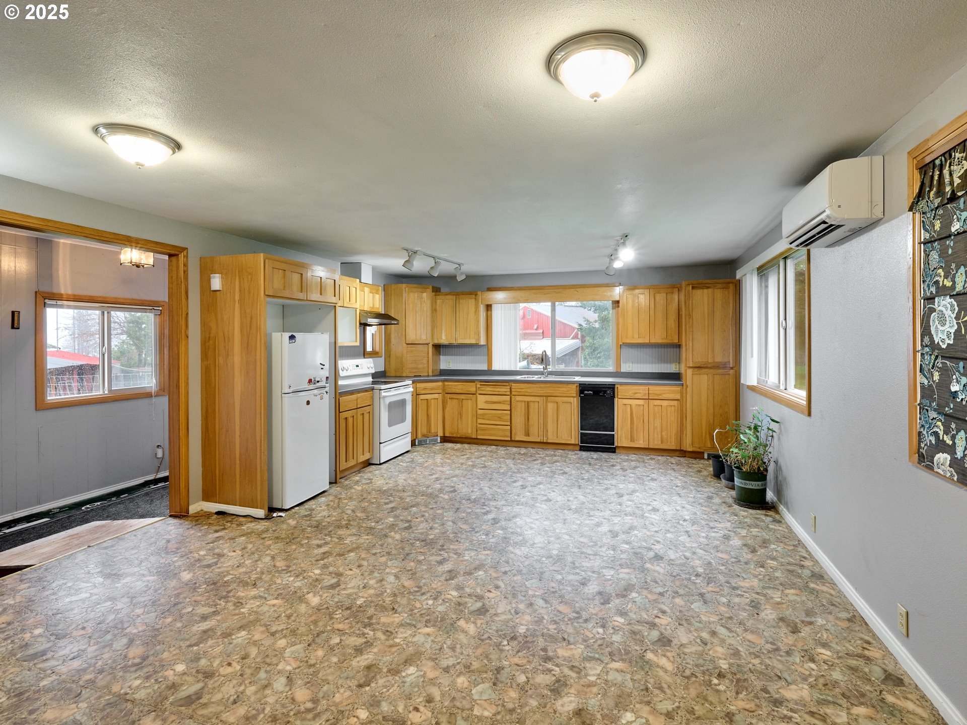 20788 Hazelnut Ridge Road Scotts Mills, OR 97375 - Photo 41 of 46 a view of a kitchen with refrigerator and windows