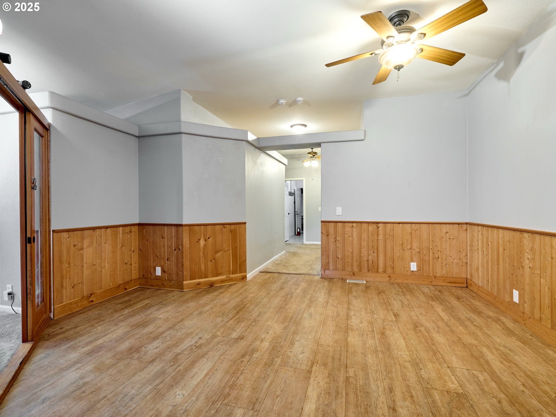 20788 Hazelnut Ridge Road Scotts Mills, OR 97375 - Photo 6 of 46 a view of empty room with wooden floor