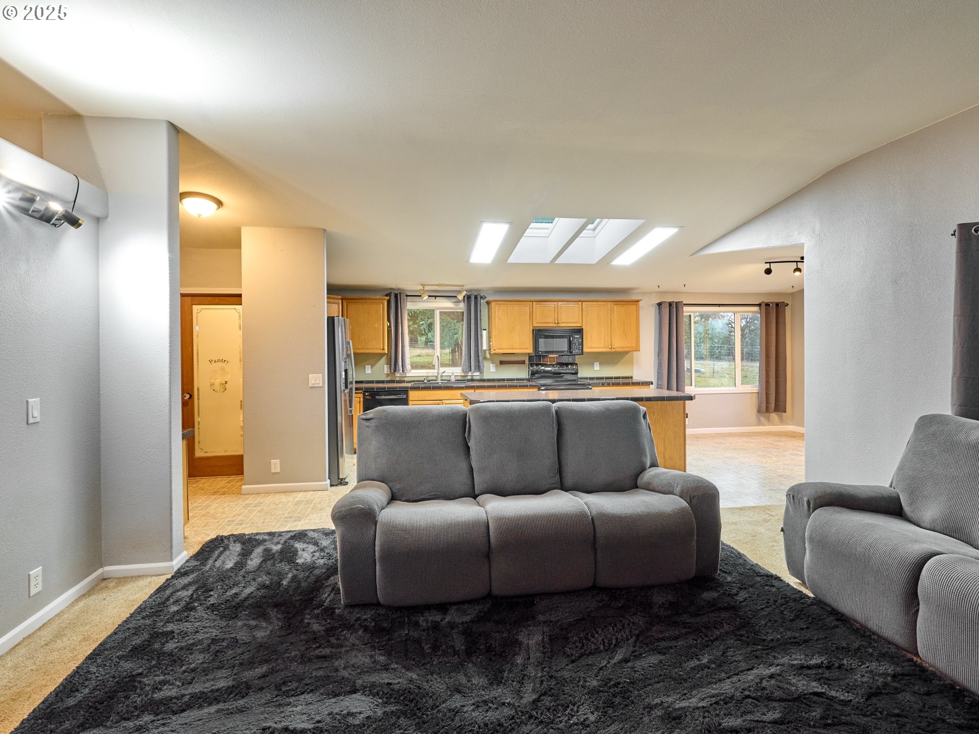 20788 Hazelnut Ridge Road Scotts Mills, OR 97375 - Photo 10 of 46 a living room with furniture and a large window