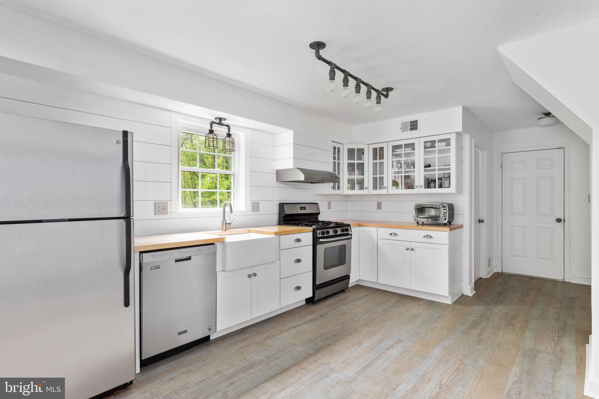 286 Ebenezer Road Bluemont, VA 20135 - Photo 9 of 49 Kitchen with newer white cabinet and wood counters