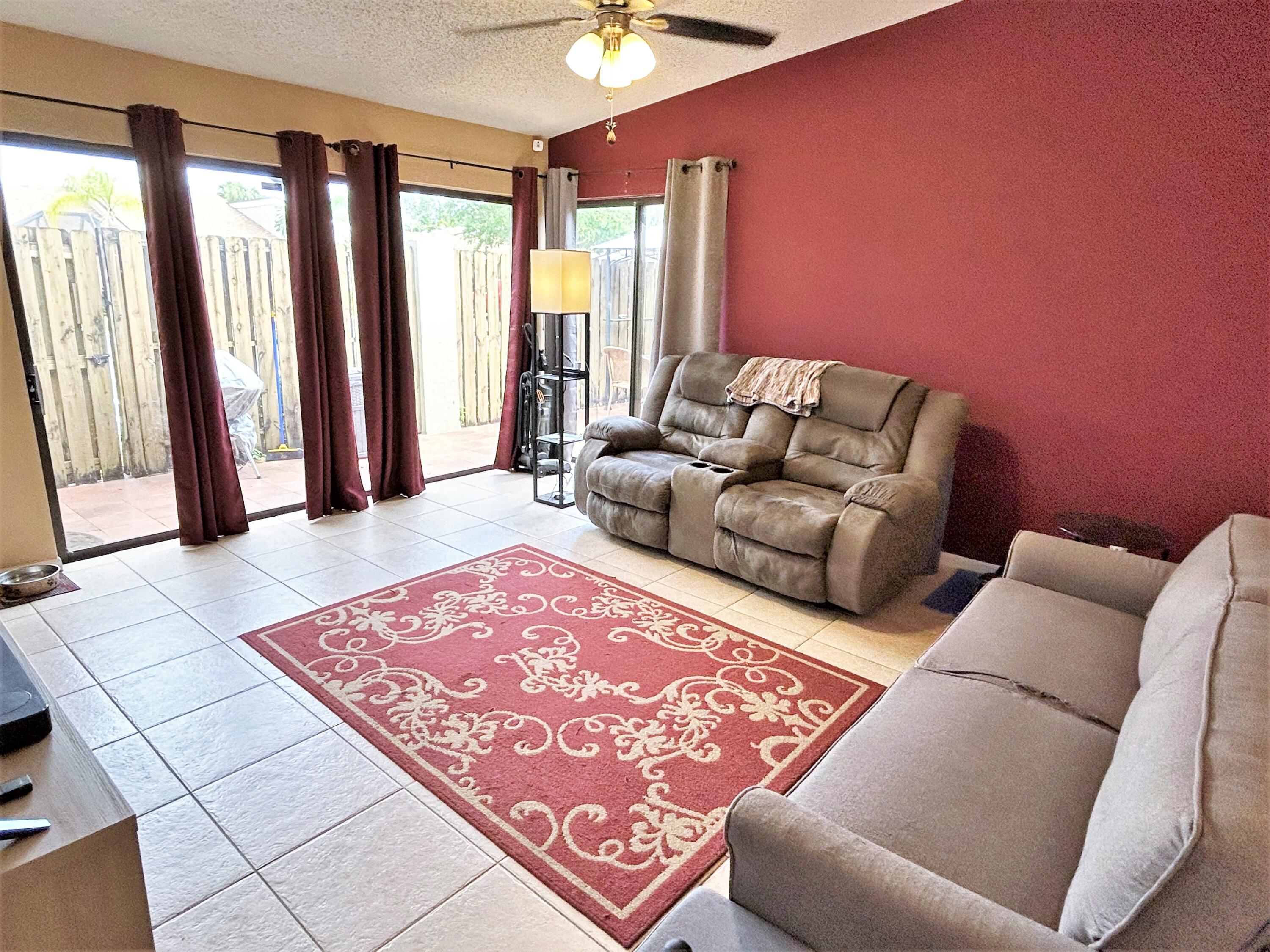 201 Meadows Drive Boynton Beach, FL 33436 - Photo 15 of 40 a living room with furniture and a rug