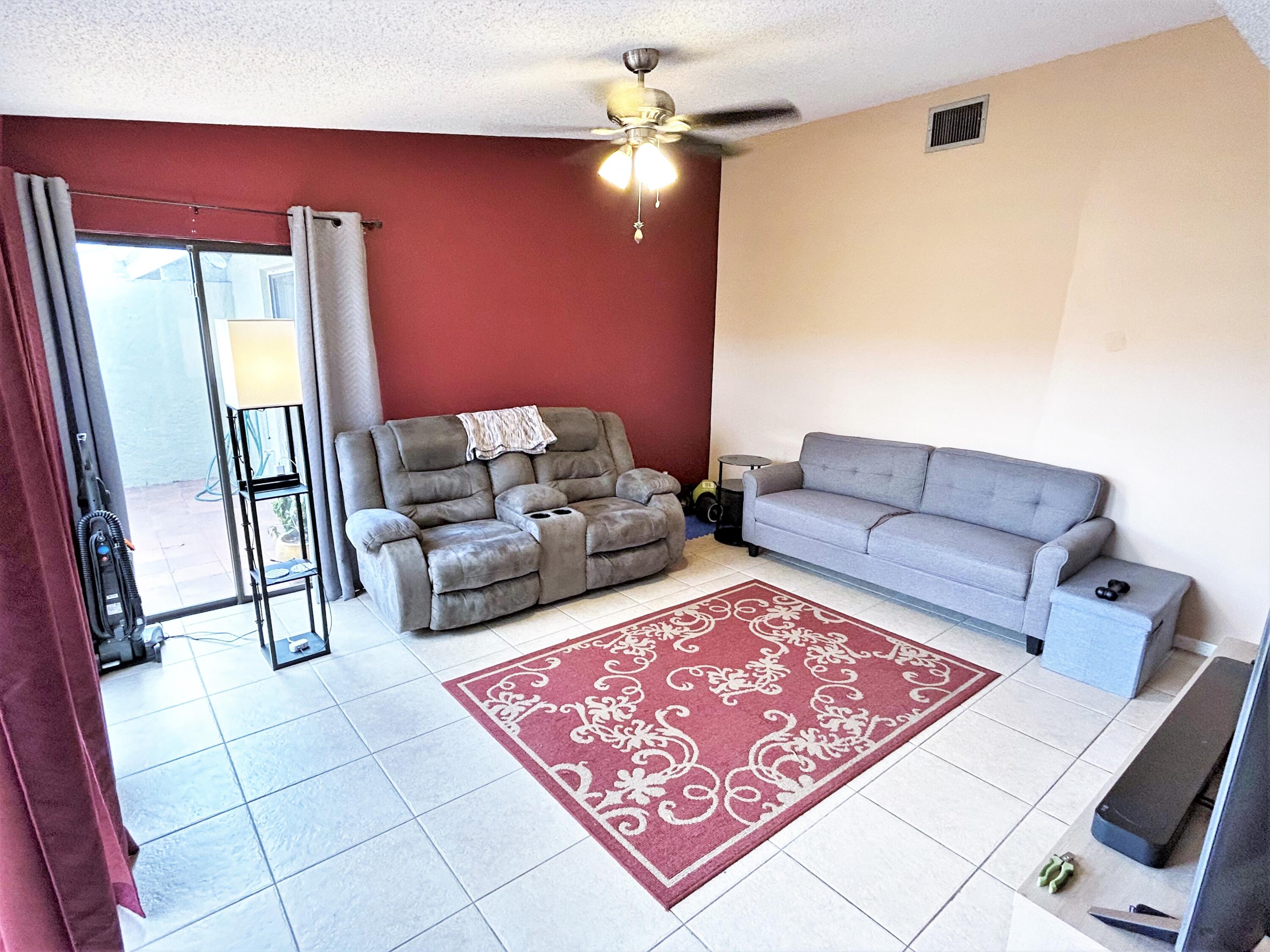 201 Meadows Drive Boynton Beach, FL 33436 - Photo 16 of 40 a living room with furniture and a rug