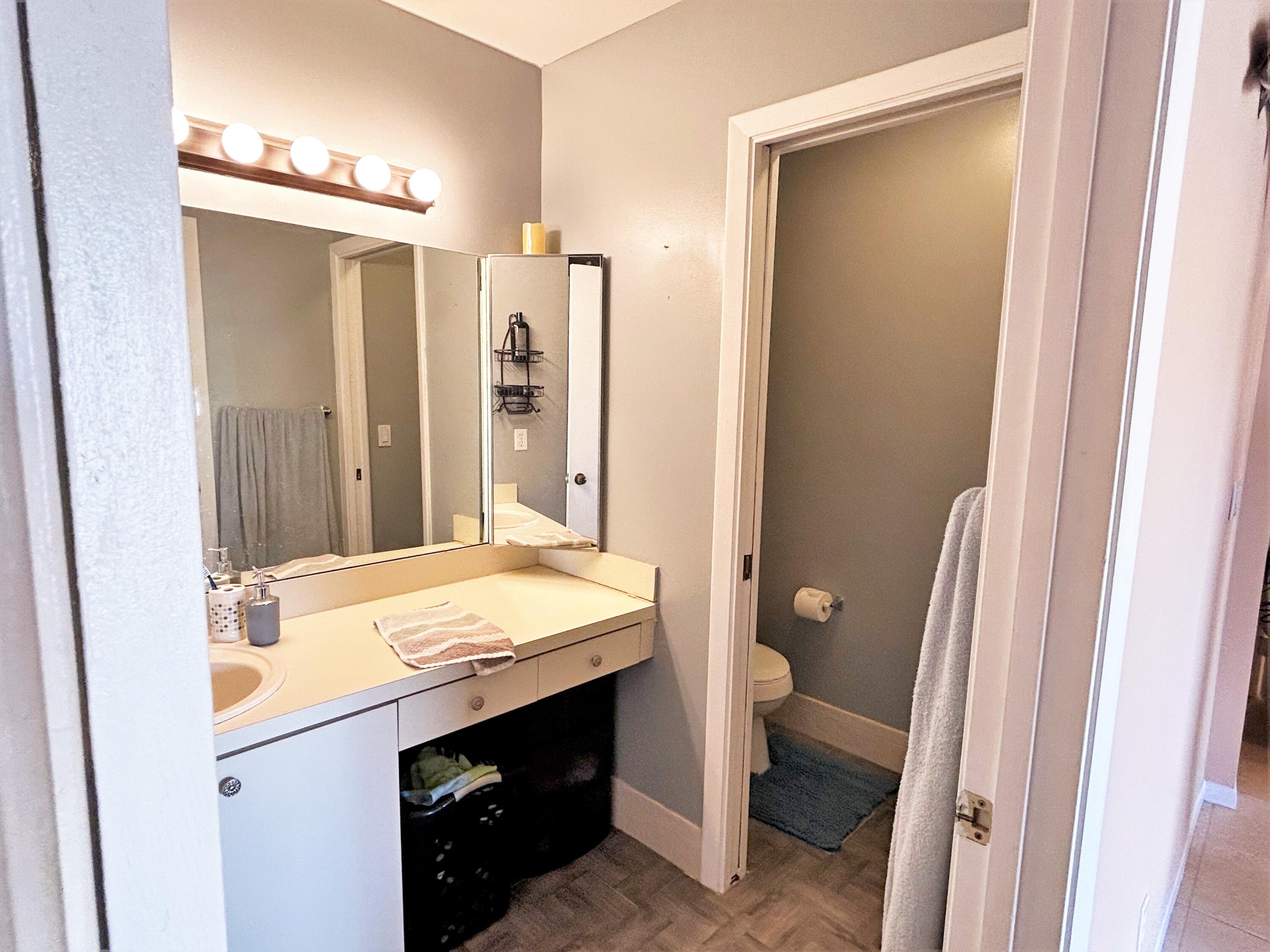 201 Meadows Drive Boynton Beach, FL 33436 - Photo 24 of 40 a bathroom with a granite countertop sink and a mirror