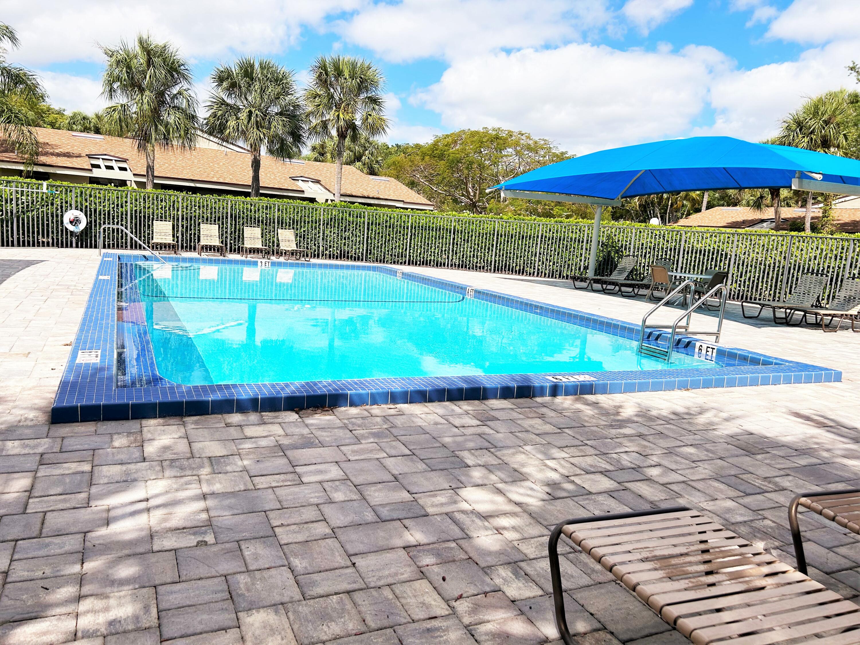 201 Meadows Drive Boynton Beach, FL 33436 - Photo 31 of 40 a view of a yard with an umbrella