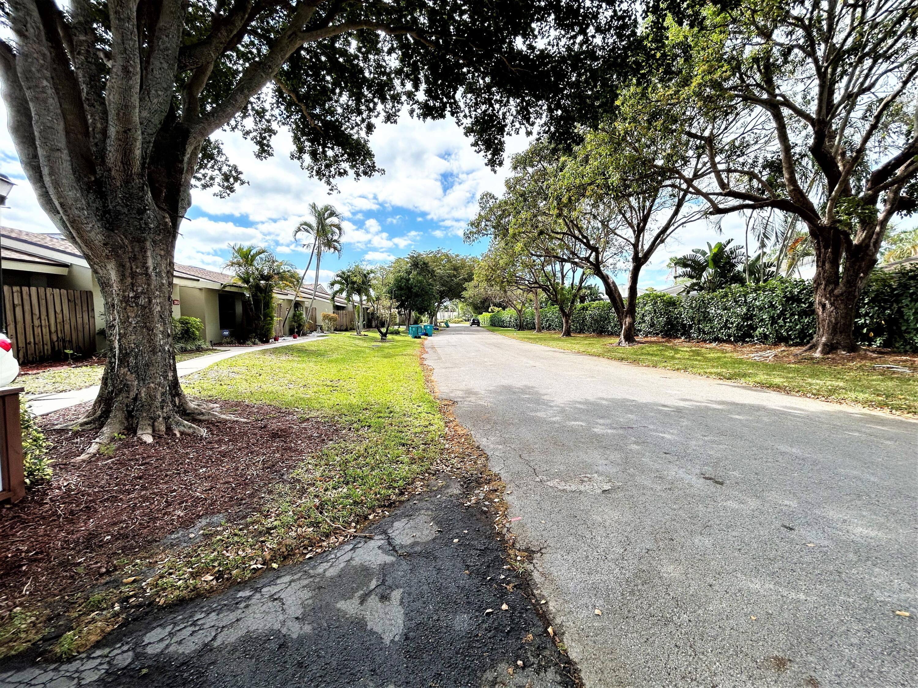 201 Meadows Drive Boynton Beach, FL 33436 - Photo 38 of 40 a view of a backyard with swimming pool