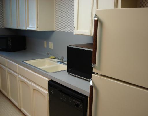 5165 Middlecoff Circle Corpus Christi, TX 78413 - Photo 2 of 10 a kitchen with a sink and cabinets