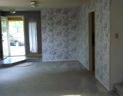 a view of a hallway with a window