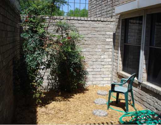 5165 Middlecoff Circle Corpus Christi, TX 78413 - Photo 10 of 10 a backyard of a house with table and chairs