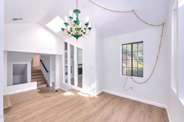 a view of an entryway with wooden floor