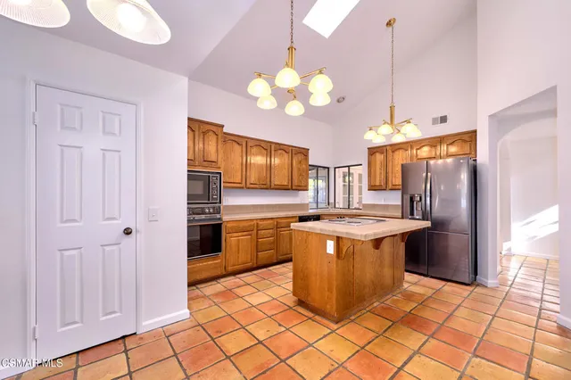 a view of an empty room and a window