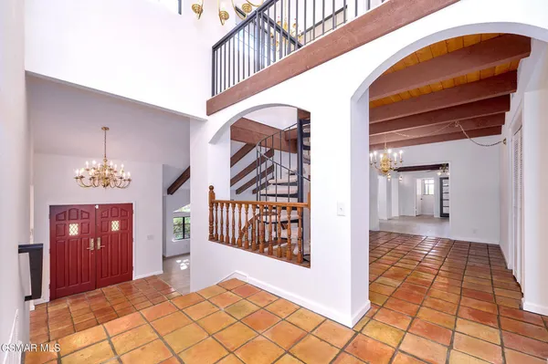 a view of an empty room and a window