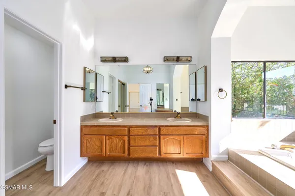 a bathroom with a sink a vanity and a mirror