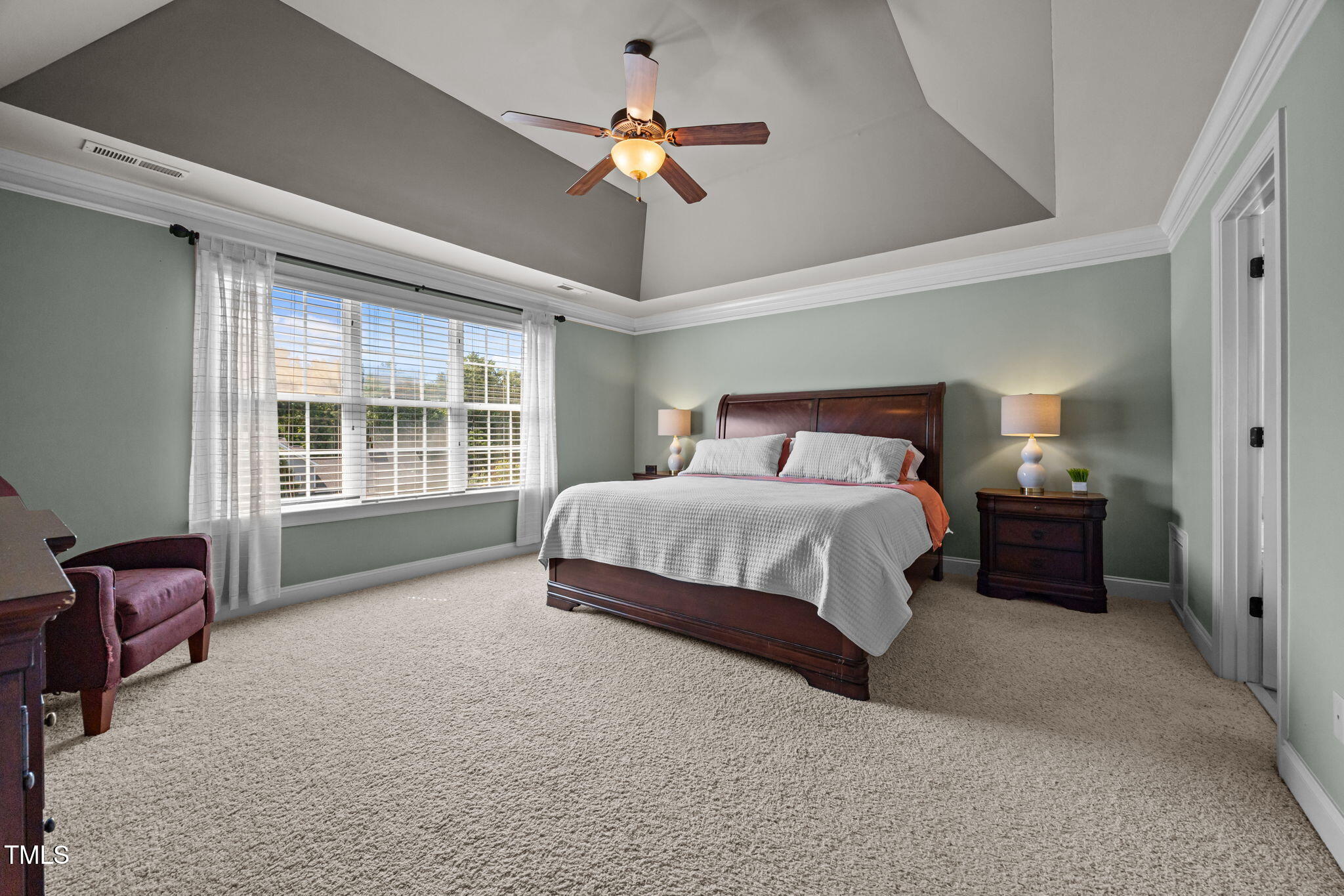 135 Brookstone Way Angier, NC 27501 - Photo 34 of 48 a bedroom with a bed dresser and a window