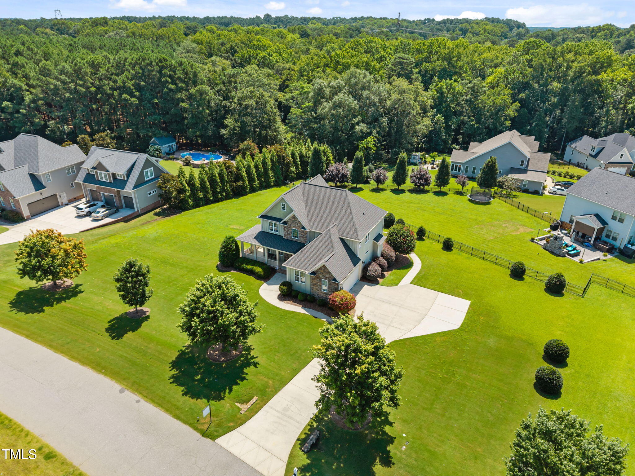 135 Brookstone Way Angier, NC 27501 - Photo 8 of 48 an aerial view of a house with swimming pool big yard and large trees