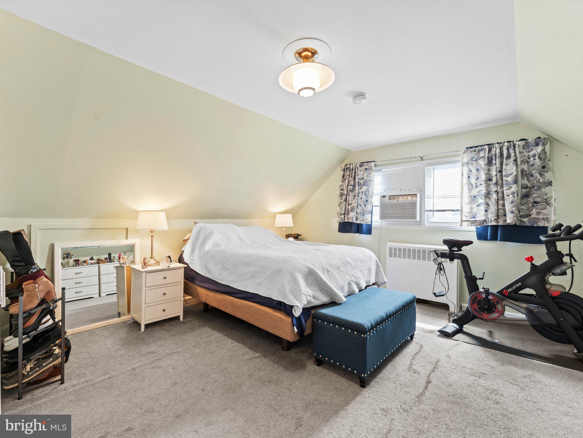 21 Viewpoint Lane Levittown, PA 19054 - Photo 16 of 26 a spacious bedroom with a bed and a chandelier