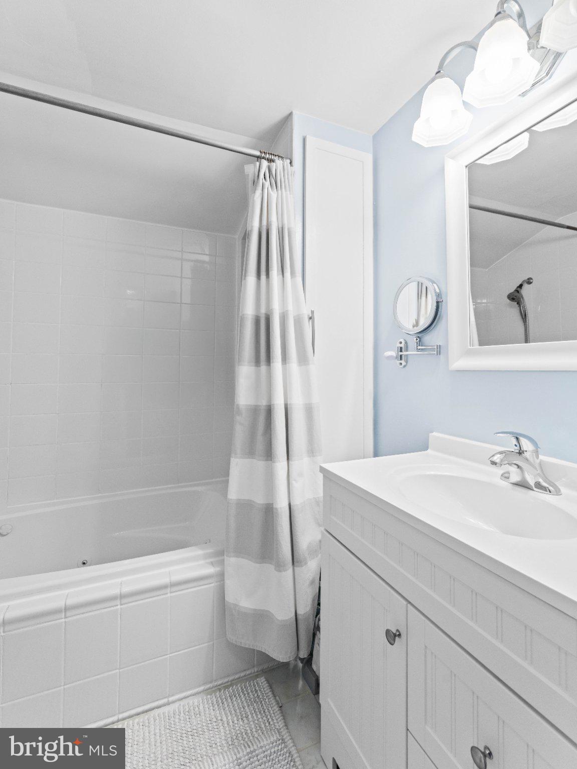 21 Viewpoint Lane Levittown, PA 19054 - Photo 20 of 26 a bathroom with a sink a mirror and a bathtub