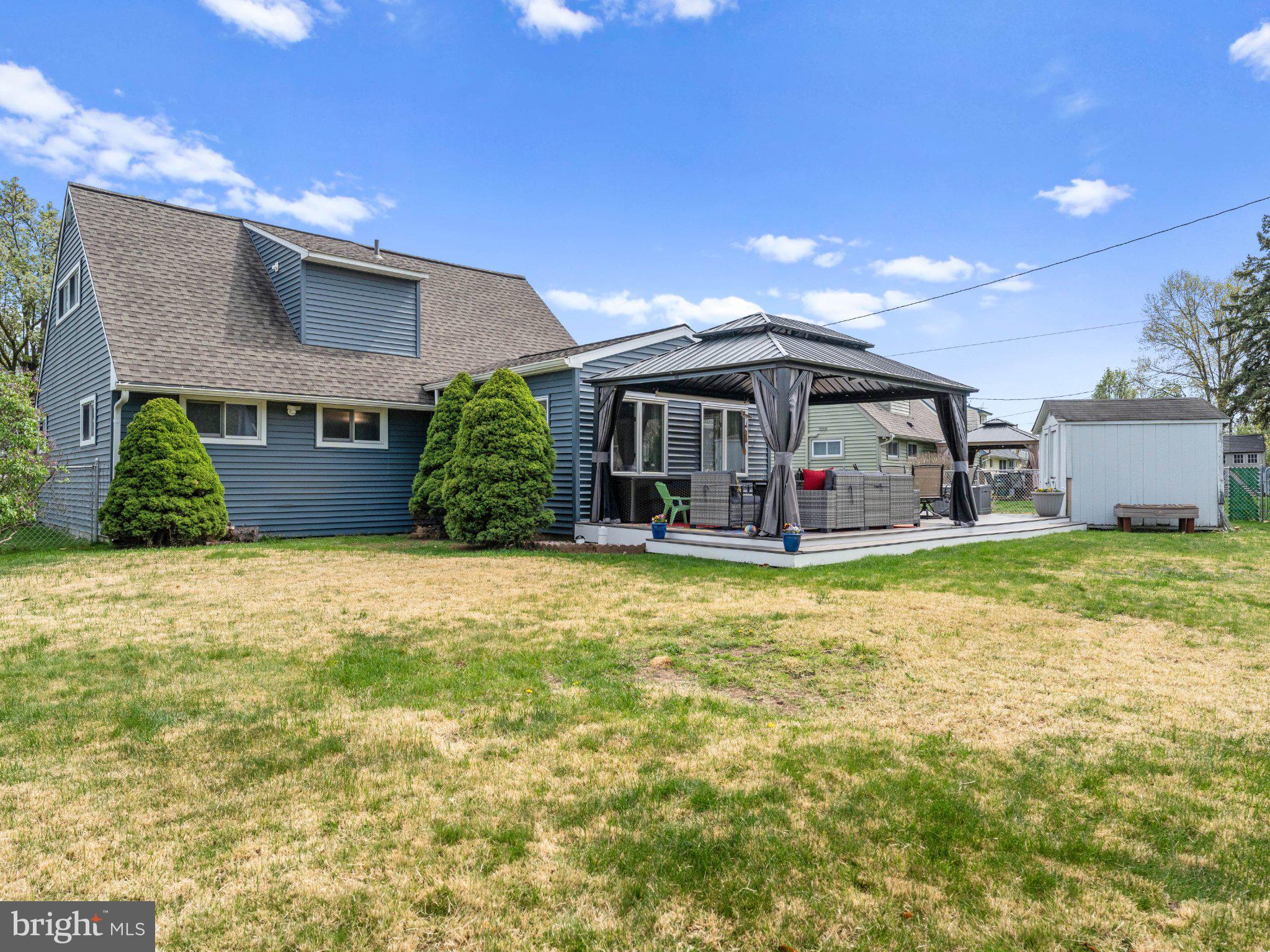 21 Viewpoint Lane Levittown, PA 19054 - Photo 25 of 26 a front view of a house with a yard