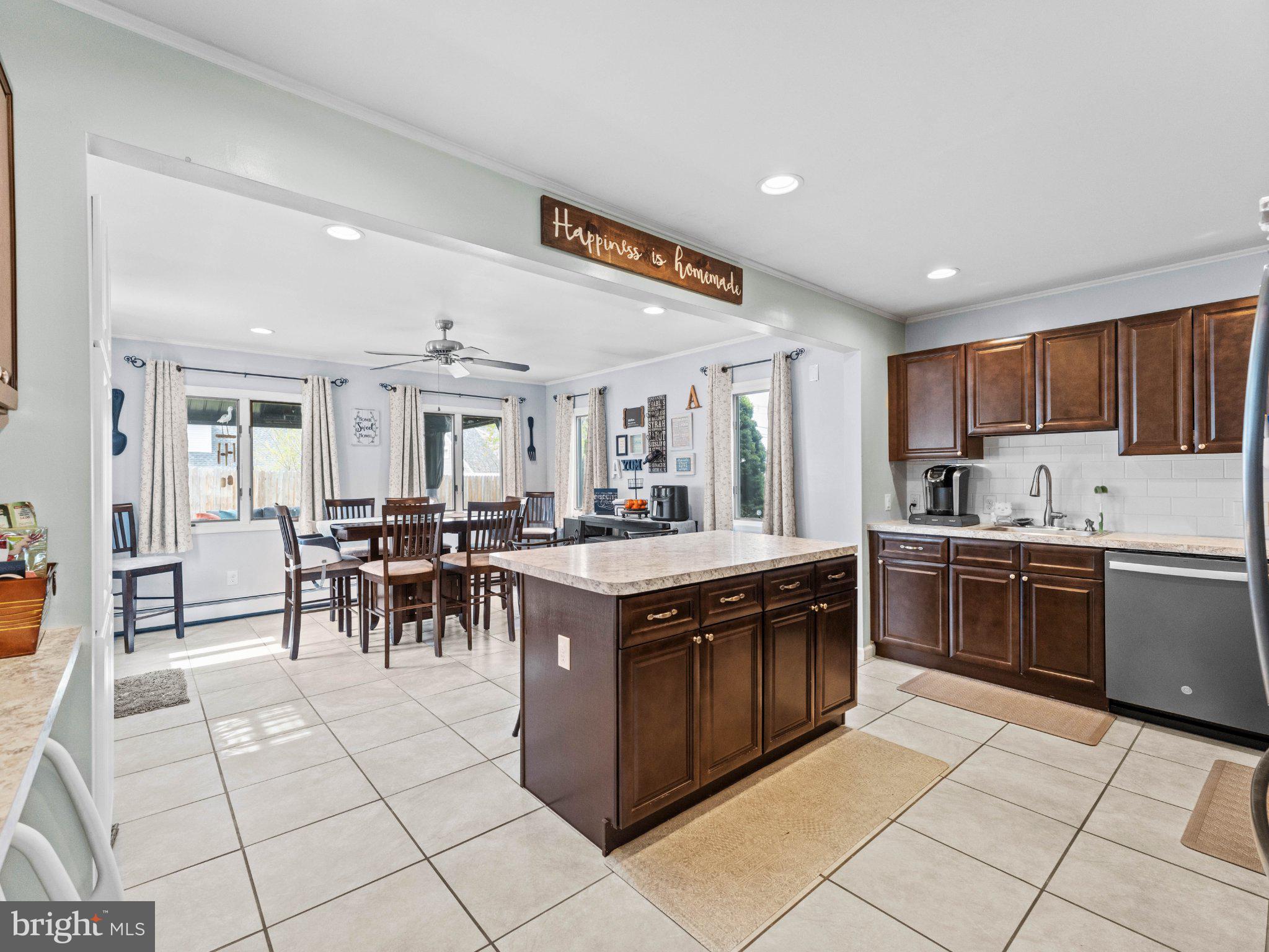 21 Viewpoint Lane Levittown, PA 19054 - Photo 6 of 26 a kitchen with stainless steel appliances granite countertop a stove top oven a sink a counter top space and cabinets