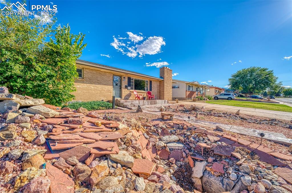 48 Duke Street Pueblo, CO 81005 - Photo 25 of 29 a view of a house with a yard and sitting area