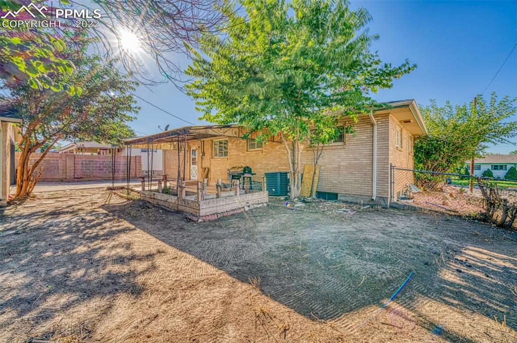 48 Duke Street Pueblo, CO 81005 - Photo 28 of 29 a view of backyard with a garden and trees