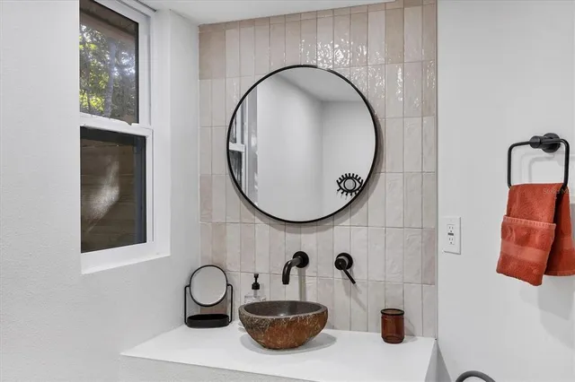 a living room with a fireplace and a window
