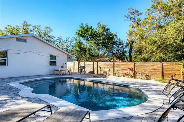 a view of a patio with a table and chairs