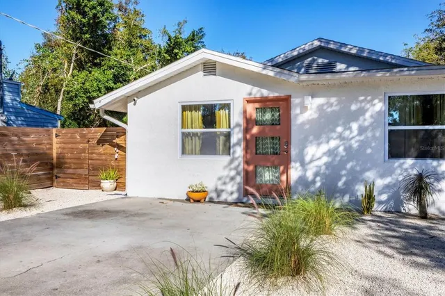 a kitchen with a sink a stove and cabinets