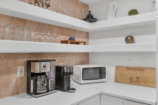 a kitchen with stainless steel appliances a refrigerator sink and cabinets
