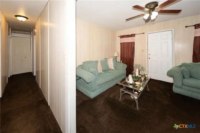 a kitchen with stainless steel appliances a sink window and cabinets