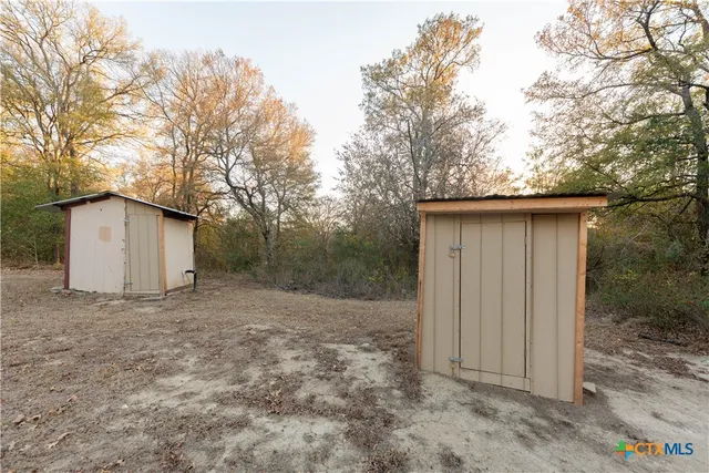 a view of a forest with trees in front of it