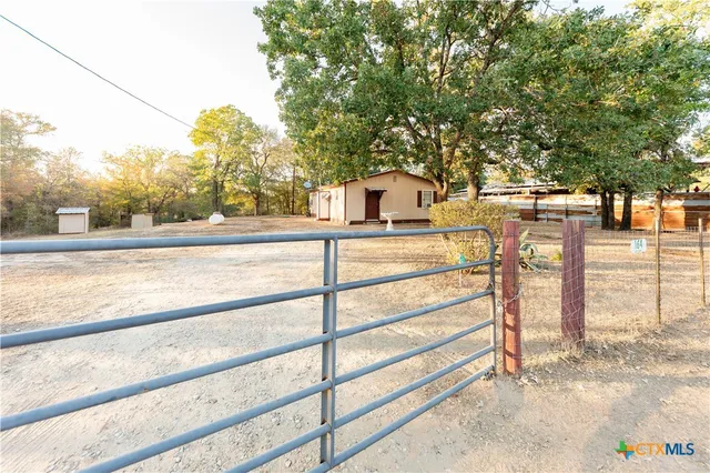 a view of a yard and front view of a house