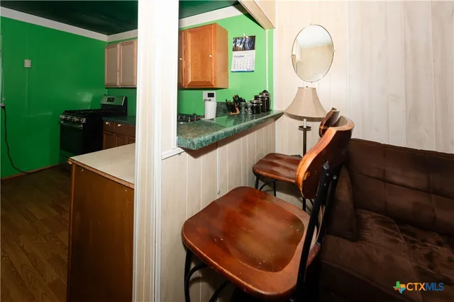 a living room with furniture a ceiling fan and a window