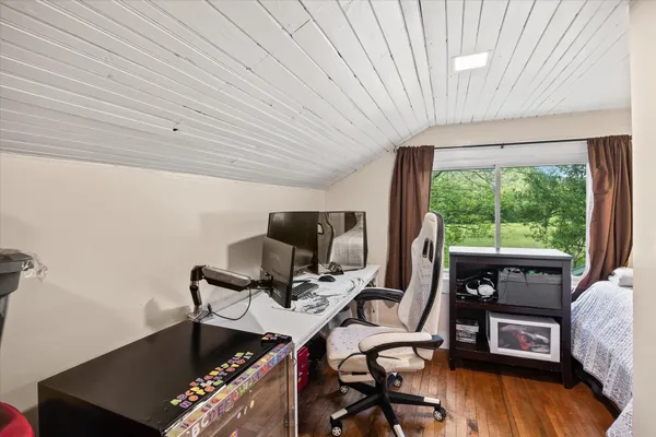 a work room with furniture and a window
