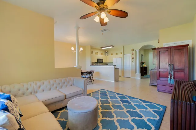 a living room with furniture and a rug