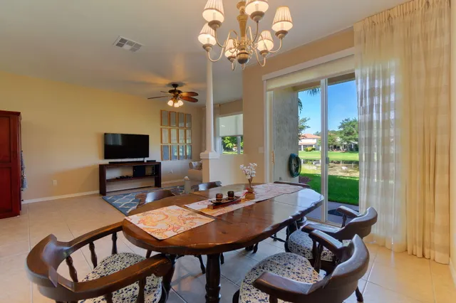 a view of a dining room with furniture window and outside view