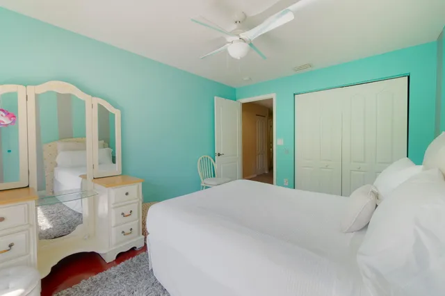 a bedroom with a bed and a dresser