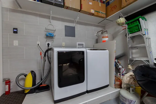 a utility room with dryer and washer