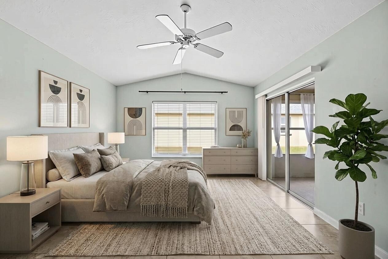 5925 Foxtail Way Fort Pierce, FL 34982 - Photo 14 of 29 a bedroom with a large bed and a potted plant