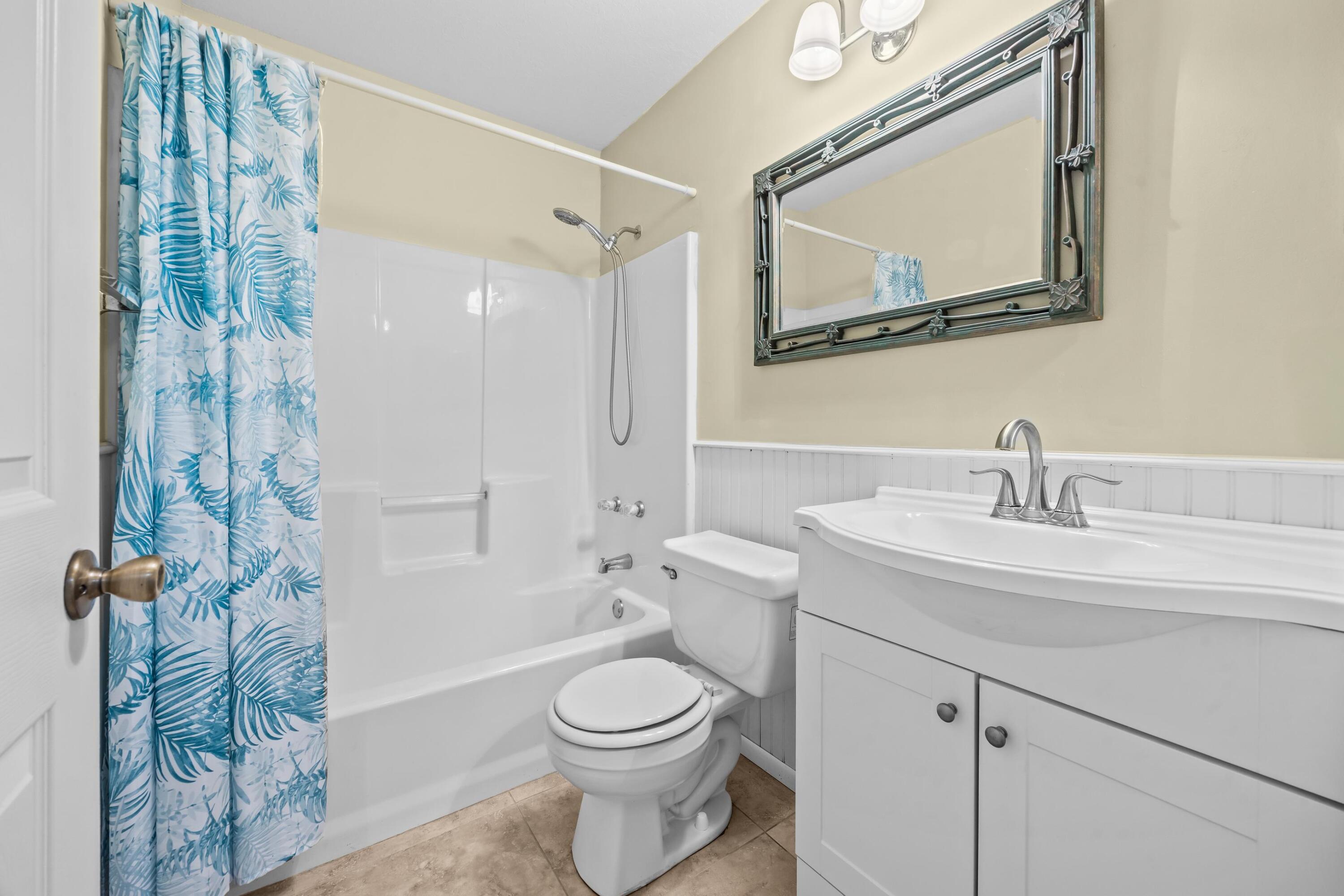 5925 Foxtail Way Fort Pierce, FL 34982 - Photo 15 of 29 a bathroom with a sink a toilet and shower