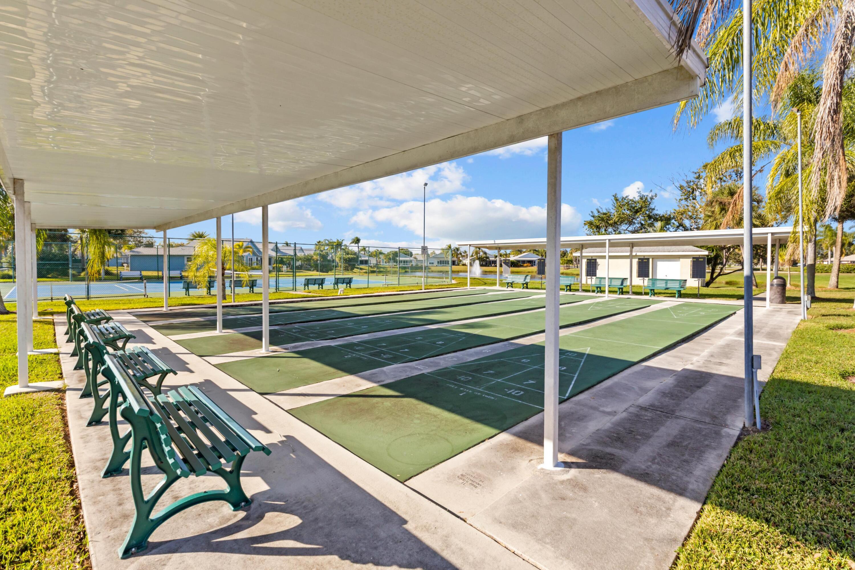 5925 Foxtail Way Fort Pierce, FL 34982 - Photo 22 of 29 a view of a patio with a table and chairs