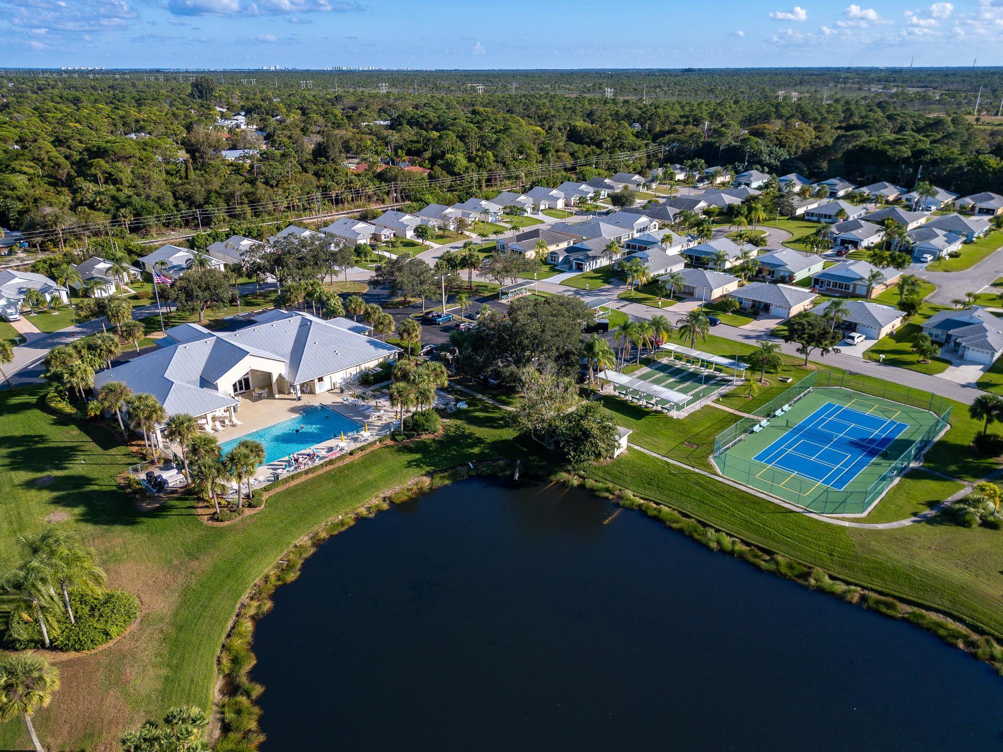 5925 Foxtail Way Fort Pierce, FL 34982 - Photo 23 of 29 an aerial view of a houses with a lake