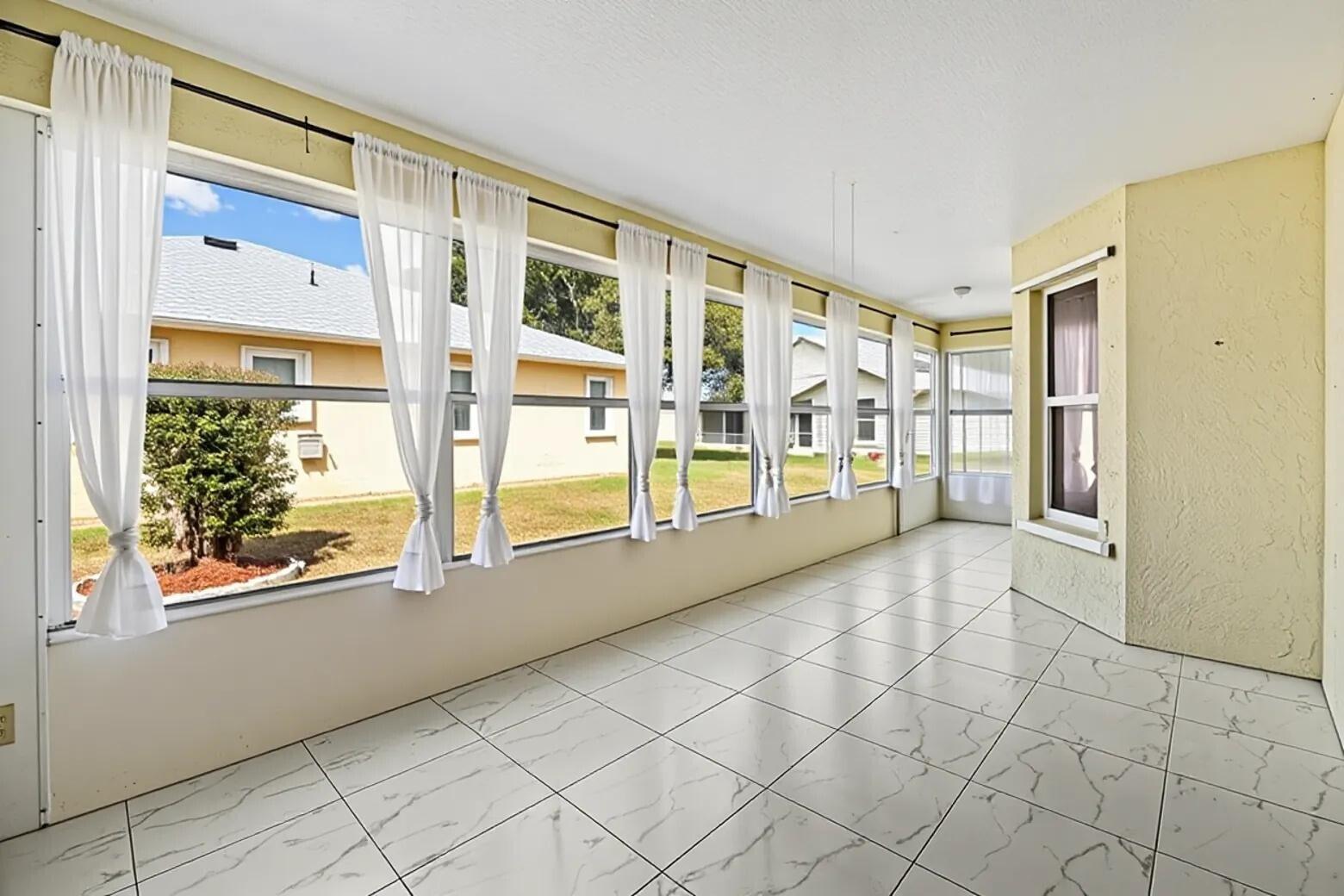 5925 Foxtail Way Fort Pierce, FL 34982 - Photo 26 of 29 a view of an entryway with wooden floor