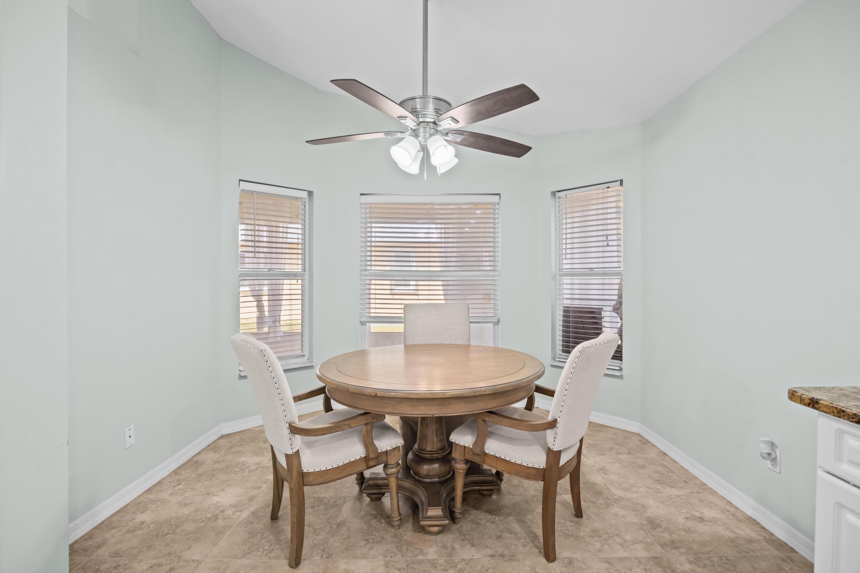 5925 Foxtail Way Fort Pierce, FL 34982 - Photo 10 of 29 a dining room with furniture and window